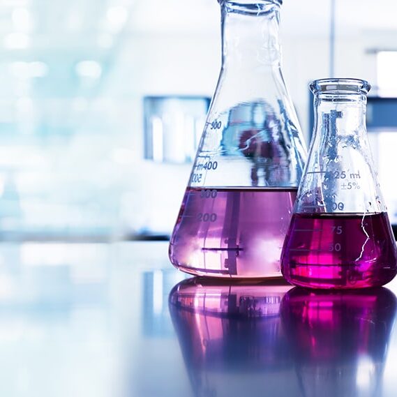purple glass flask in blue research chemistry science banner laboratory background